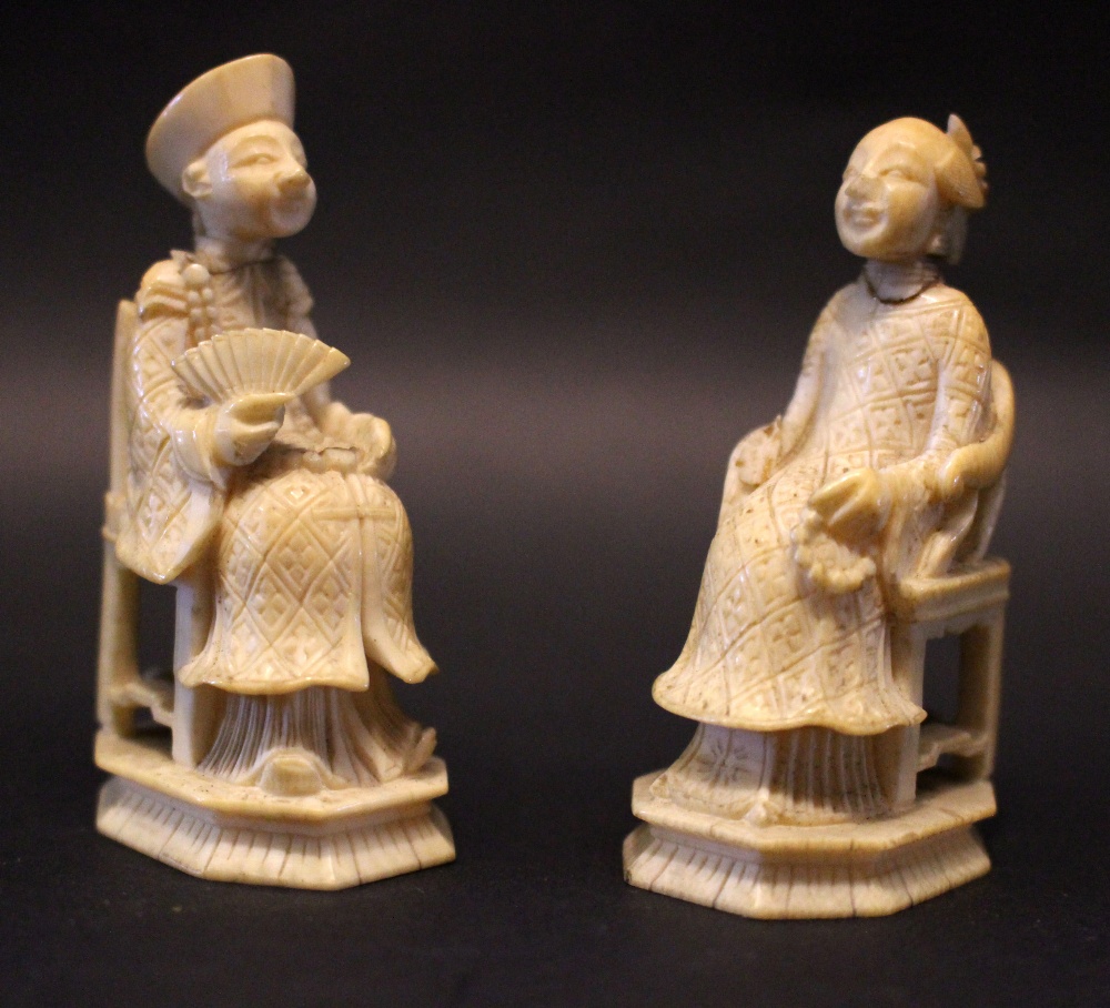 A PAIR OF CARVED IMPERIAL FIGURES, a man holding a fan, a lady holding beads, old breaks repaired,