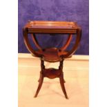 A MAHOGANY THREE TIER TRAY TABLE / DRINKS TABLE, with lift away glass tray, over a clover shaped