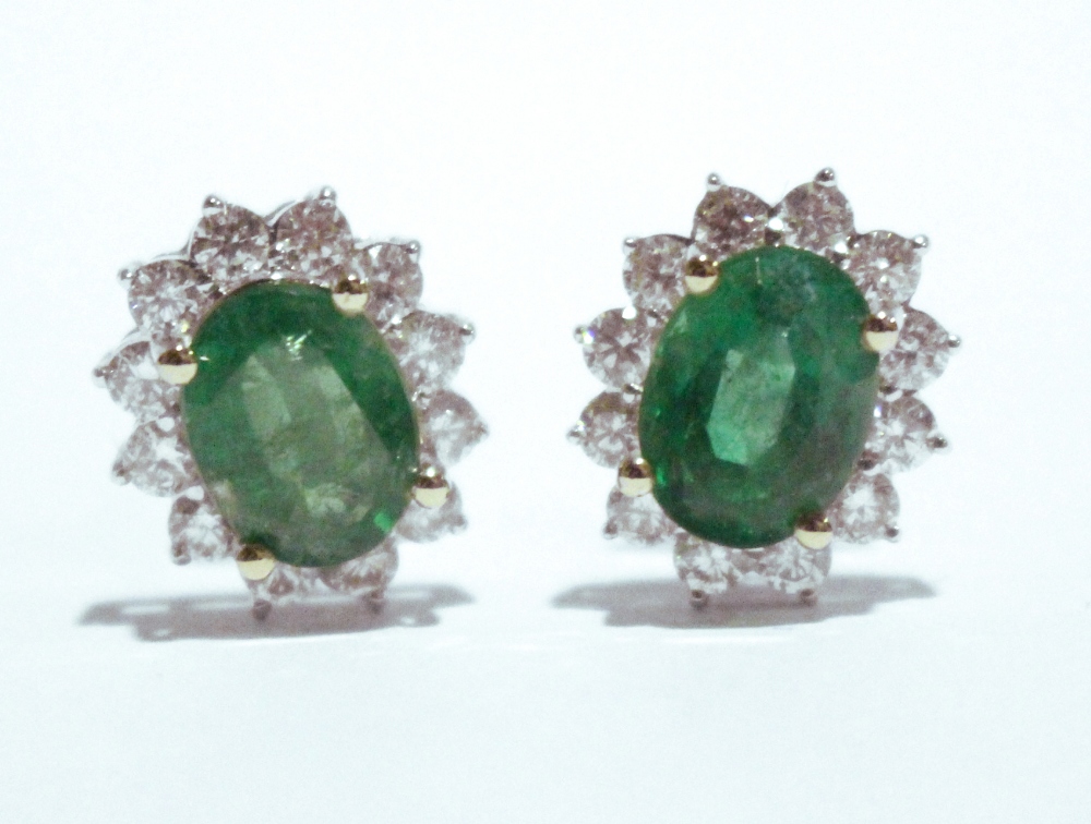 A PAIR OF 18CT WHITE GOLD EMERALD & DIAMOND CLUSTER EARRINGS, Colombian emeralds, 1.20cts