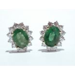 A PAIR OF 18CT WHITE GOLD EMERALD & DIAMOND CLUSTER EARRINGS, Colombian emeralds, 1.20cts