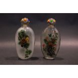 TWO SNUFF BOTTLES, (i) with images of owls, a top with spoon, (ii) flowering tree motif, with top