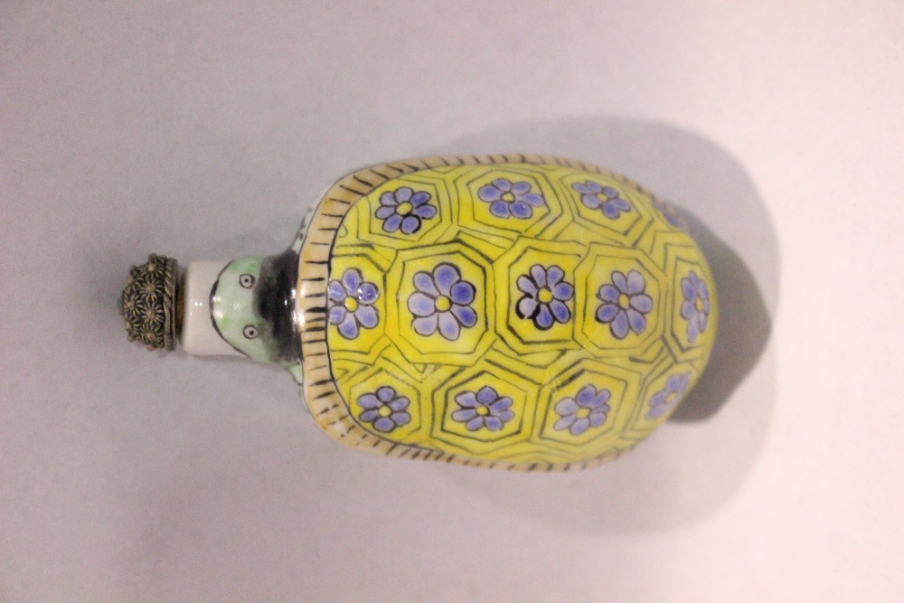 A PORCELAIN SNUFF BOTTLE, in the form of a turtle, with floral decoration to its back, a stopper - Image 2 of 4