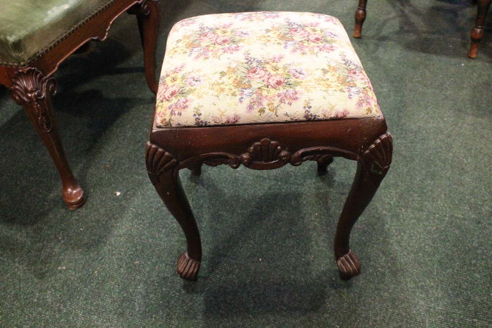 AN IRISH 19TH CENTURY CARVED FOOTSTOOL, with shell motif to the knees and apron, having a stuffed - Image 2 of 3