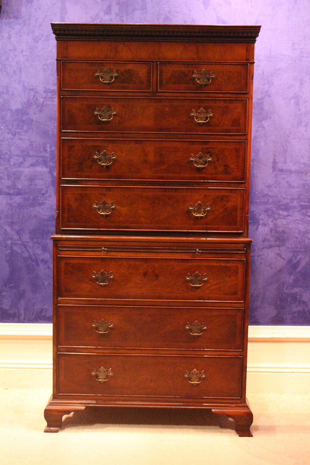 A VERY FINE CROSSBANDED CHEST ON CHEST, 2 short over 3 long, with a slide shelf over 3 further