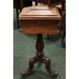 A ROSEWOOD WORK BOX, with concave body, graduated tapered lid, raised on fluted baluster shaped