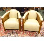 A PAIR OF CREAM LEATHER 'AVIATOR' CHAIRS, with wooden frames, each 34" x 27" x 36" approx