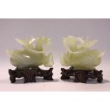 A MATCHING PAIR OF JADE ‘DUCK & LOTUS’ CARVINGS, each with exceptional detail, the recumbent ducks
