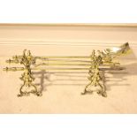 A GOOD SET OF THREE BRASS FIRE IRONS & DOGS