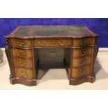 A GOOD QUALITY 19TH CENTURY LEATHER TOPPED PEDESTAL DESK, with 3 serpentine shaped graduated drawers