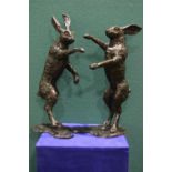 A PAIR OF 20TH CENTURY BRONZE BOXING HARES, with foundry mark to base, 2ft high each