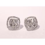 A PAIR OF 18CT WHITE GOLD DIAMOND HALO STUD EARRINGS