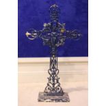 A CAST IRON CRUCIFIX with floral decoration and image of Mary to the centre, 35" x 20" approx