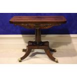 AN EXCEPTIONALLY FINE REGENCY ROSEWOOD FOLD OVER TEA TABLE, with decorative carved frieze, raised on