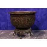 A BRONZE CHINESE VESSEL raised on a stand, 14" diam, 2ft high on stand