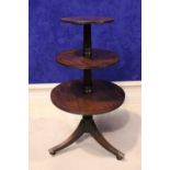 A VERY FINE IRISH GEORGIAN MAHOGANY ‘DUMB WAITER”, with fluted and turned column supports, 3 tiers