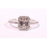 AN 18CT WHITE GOLD BAGUETTE CUT SOLITARE DIAMOND RING