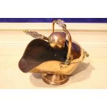 A COPPER COAL SCUTTLE, helmet shaped with glass handle and shovel included
