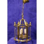 A HANGING BRASS LANTERN, 14" high, 11" wide