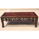AN 20TH CENTURY LOW RISE TEA TABLE, hardwood, with carved frieze, 35" x 16" x 12" approx