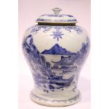 A BLUE & WHITE GINGER JAR, with lid, decorated to the body with images of figures on a bridge, and