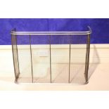 A GOOD QUALITY METAL ‘NURSERY FENDER’ with curved mesh body and chrome frame, 38” x 12” approx
