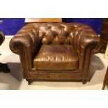 A PAIR OF ANTIQUE STYLE CHESTERFIELD BROWN LEATHER CLUB ARMCHAIRS, button back and arms, 45" x 34" x