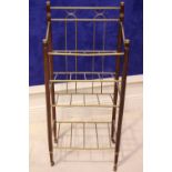 A BRASS & WOODEN SHOE STAND/TIDY, with turned legs on castors, 40" x 17" x 11" approx