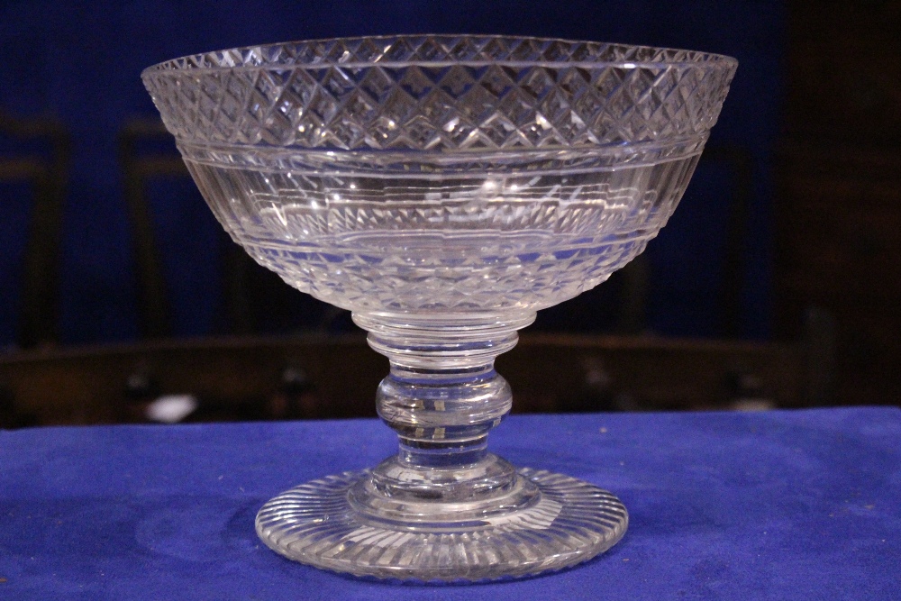 A VERY GOOD EARLY 19TH CENTURY IRISH CUT GLASS PEDESTAL BOWL, oval shaped with a band of hobnail cut