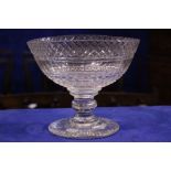 A VERY GOOD EARLY 19TH CENTURY IRISH CUT GLASS PEDESTAL BOWL, oval shaped with a band of hobnail cut