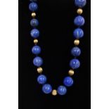 A RUSSIAN VINTAGE LAPIS BEADS FINISHED WITH 18CT YELLOW GOLD BEADSS