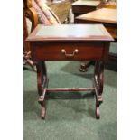 A 20TH CENTURY SIDE TABLE, with leather top, raised on a pair of lyre shaped side supports, united