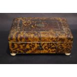 A 19TH CENTURY TORTOISE SHELL SEWING BOX, veneered with figured tortoise shell panels divided by