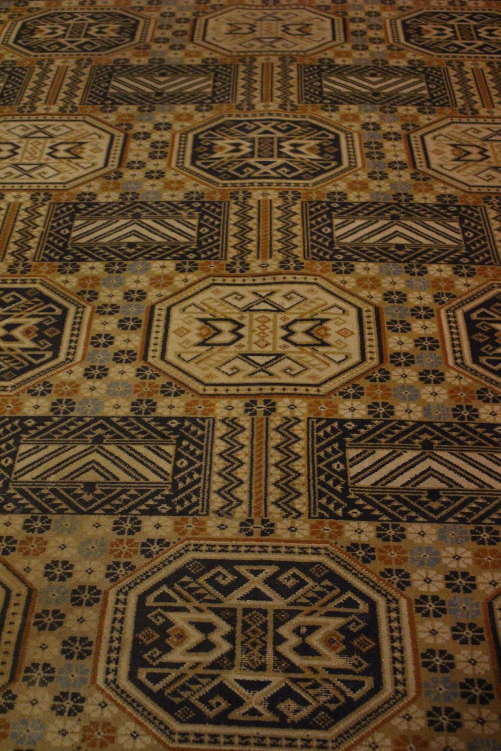 A LARGE FLOOR RUG, with geometric motif, in excellent condition, 140" x 98" approx - Image 2 of 2