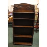 A SET OF OAK BOOK SHELVES, floor standing, with carved detail to the top, 5 shelves, 46" x 22" x