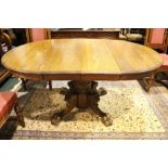 A 'JEFFERSON WOODWORKING CO.' EASY SLIDE, DINING TABLE, adjustable, circular with two leaves to make
