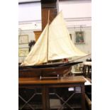 A LARGE MODEL YACHT, on stand, with plate stating "Nauticalia"