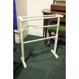 A TURNED WOODEN TOWEL RAIL, country house style, painted white, 26" x 7" x 31" approx