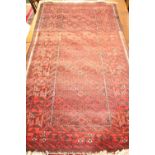 A GOOD QUALITY 'BALUCH' FLOOR RUG, with main ground red, multi border, 39" x 77", circa 1970