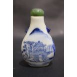 A BLUE & WHITE CHINESE SNUFF BOTTLE, with a jade stopper and spoon, decorated with landscape and