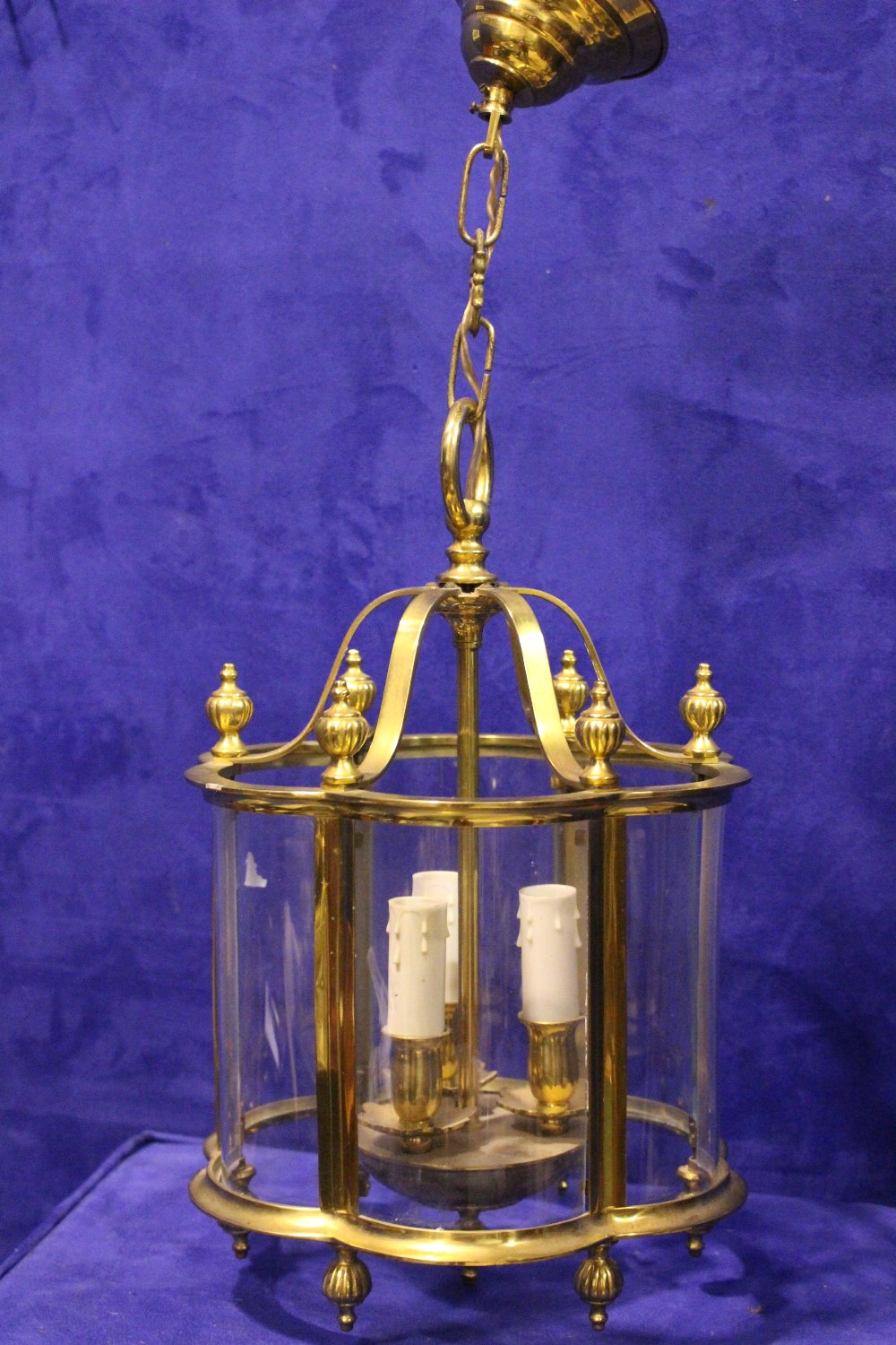 A HANGING BRASS LANTERN, 14" high, 11" wide