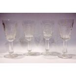 A SET OF 4 COMMEMORATIVE WINE GLASSES, depicting the faces of famous Irish people, includes, (i)