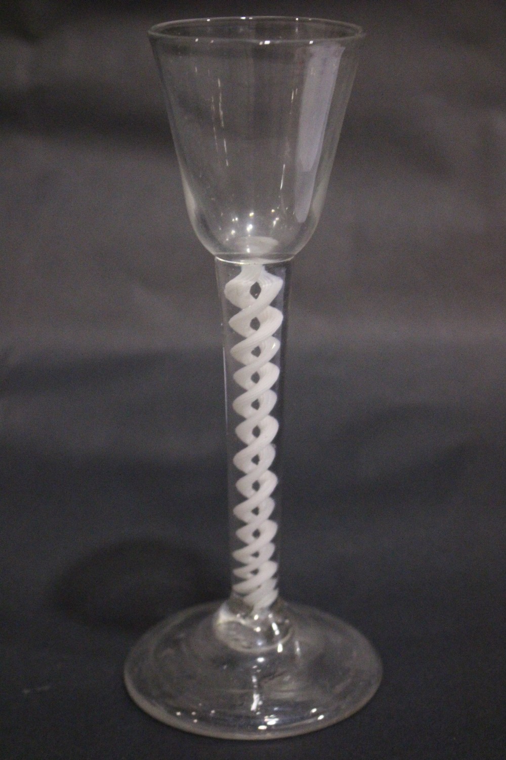 AN 18TH CENTURY DOUBLE OPAQUE TWIST STEM WINE GLASS, 6.75" tall approx, in excellent condition