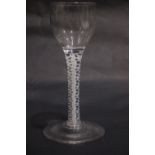 A GEORGIAN 18TH CENTURY ‘OPAQUE TWIST’ WINE GLASS, circa 1760, with an ovoid or ogee shaped cup,