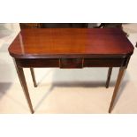 A VERY FINE GEORGE III FOLD OVER TEA TABLE, with inlaid detail, circa 1790, reeded rim, raised on