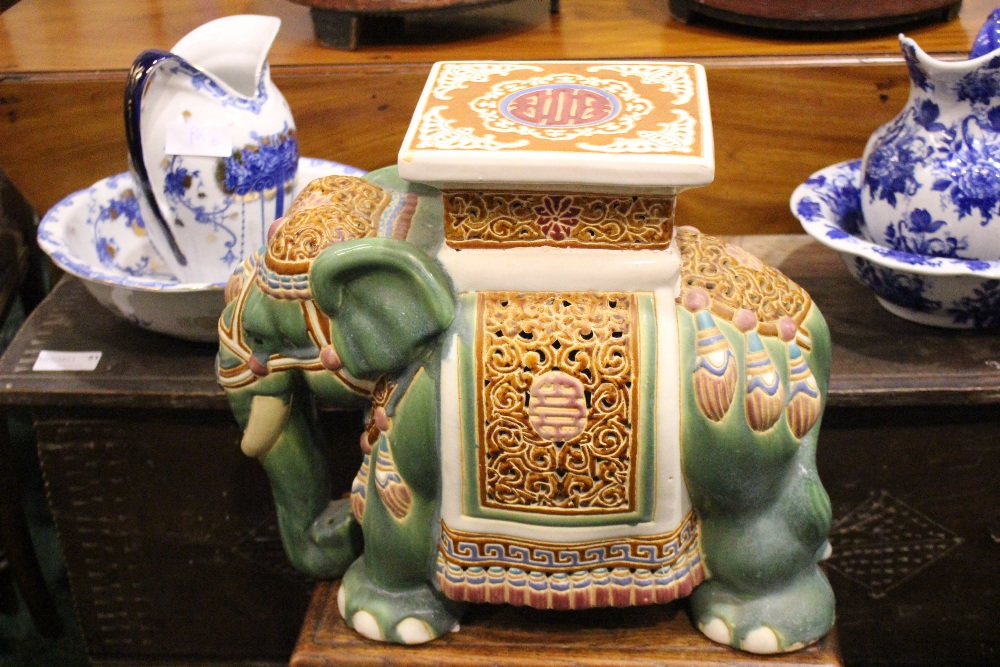 A CERAMIC JARDINERE / POT STAND IN THE FORM OF AN ELEPHANT, dressed in robes with a square seat as - Image 2 of 5