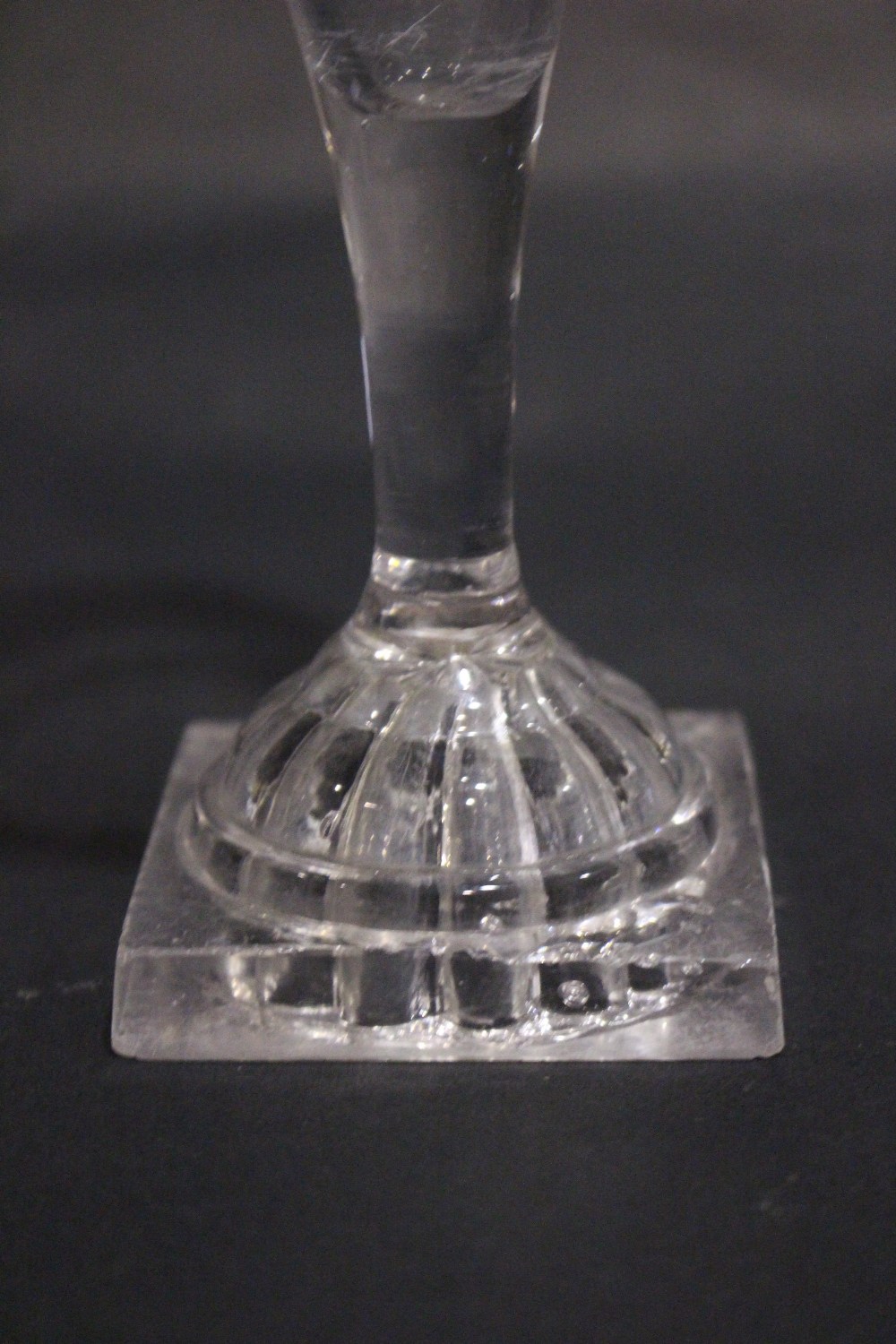 A TAPERED GLASS FLUTE, with cut detail to the rim, raised on a lemon squeeze foot / base, 7" tall - Image 3 of 4