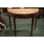 A GOOD QUALITY DEMI-LUNE FOLD OVER CARD TEA TABLE, with reeded rim, raised on tapered leg, having