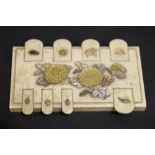 AN IVORY & MOTHER OF PEARL 'WHIST' GAME COUNTER, with floral design, some of the inlaid pieces are