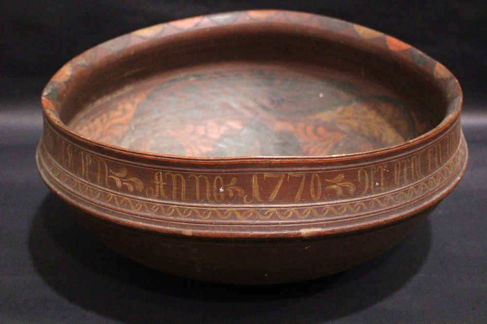 A VERY LARGE TURNED WOODEN ‘ROSEMALING’ BOWL, possibly 18th century, Scandinavian, decorated in