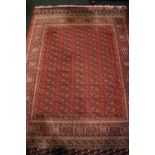 A BOKHARA STYLE FLOOR RUG, with red main ground, multi borders, 94" x 63" approx